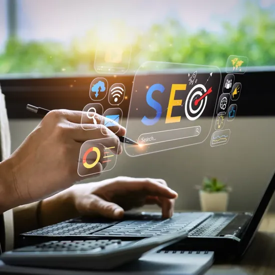 SEO graphics hovering over a laptop